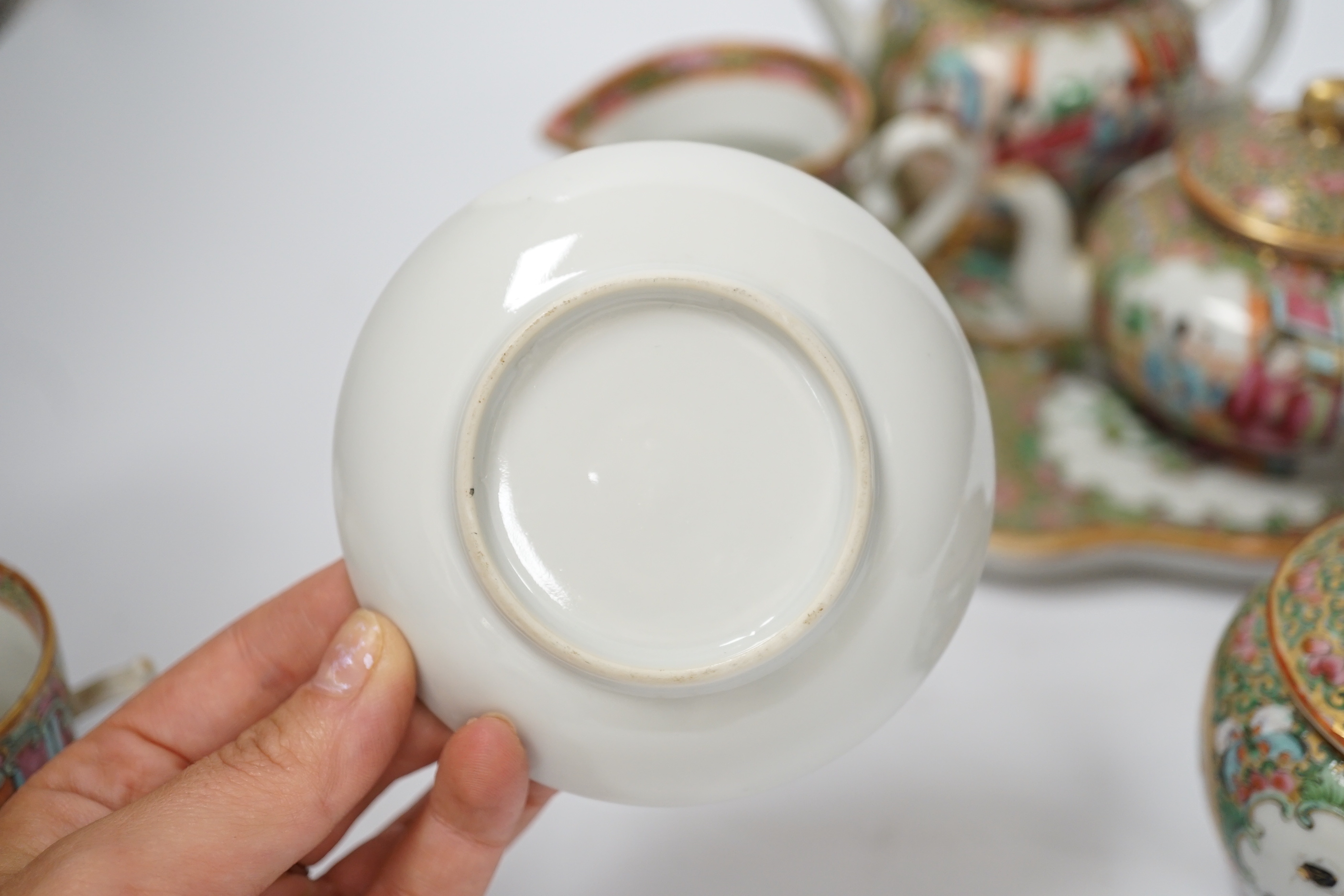 A 19th century Chinese famille rose teaset including a trefoil shaped tray, two teapots, sugar bowl, jug and cup with saucer, teapot 10cm high (6)